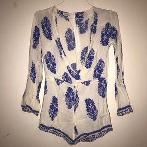 Deep V blue and white romper with feather pattern